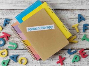 books with the words speech therapy to represent supporting children with speech disorders